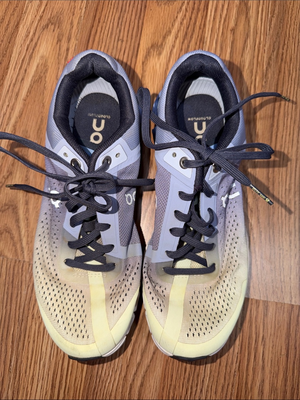 On Running women's athletic shoes in lavender and pale yellow gradient